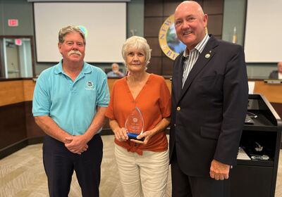 Planning & Zoning Board Chair Sandra Smith honored for contributions.