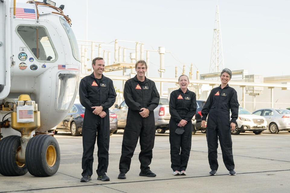 The CHAPEA mission 1 crew (from left: Nathan Jones, Ross Brockwell, Kelly Haston, Anca Selariu) exit a prototype of a pressurized rover and make their way to the CHAPEA facility ahead of their entry into the habitat on June 25, 2023. Credit: NASA/Josh Valcarcel